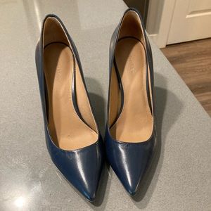 Calvin Klein size 7 - blue heels with silver detail on back. Like new